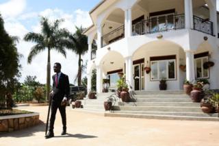 Ugandan pop star turned opposition MP, Robert Kyagulanyi better known as Bobi Wine, walks with a cane to attend his media conference at his home in Kampala on September 24, 2018.