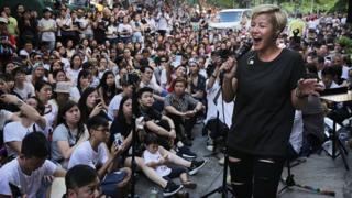 Denise Ho performs during a free concert in Hong Kong in 2016 after cosmetics giant Lancome cancelled a concert featuring the local singer
