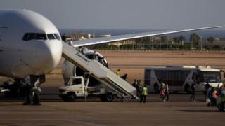Tourists disembark a Egypt Air plane in Sharm el-Sheikh