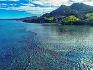 A drone image shows the oil spillage near the area where the bulk carrier ship MV Wakashio, belonging to a Japanese company but Panamanian-flagged, ran aground on a reef, at Riviere des Creoles, Mauritius.