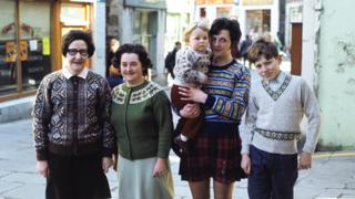 A group of women and children pose wearing a Fair Isle sweaters in Lerwick in 1970.