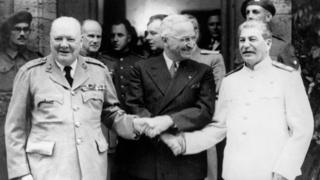 British Prime Minster Winston Churchill, US President Harry Truman and Russian leader General Stalin shaking hands during the Potsdam Conference.