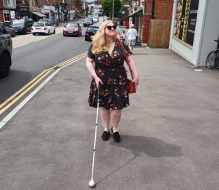 Dr Amy Kavanaugh walking along the street