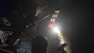 USS Ross fires a tomahawk missile April 7, 2017, at a Syrian air force base