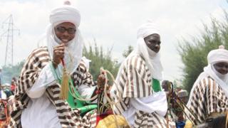 Three Muslim men dey on top horse dey jolly for Eid al-Adha
