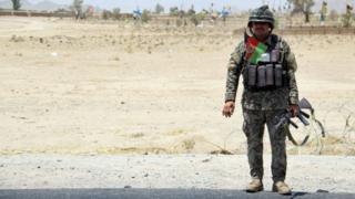 lone soldier at side of road