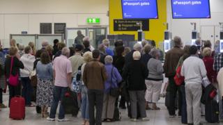 People queuing at Gatwick