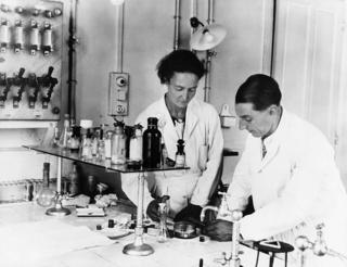 Paris, France: Frederick Joliot and his wife, Irene Curie, Physicists, who shared the Nobel Prize in 1935. Photograph in their laboratory.
