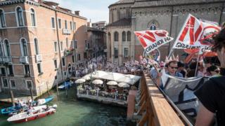 People take part in a demonstration against the passage of cruise ships in Venice Lagoon, on June 8, 2019