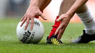Man lifting GAA ball