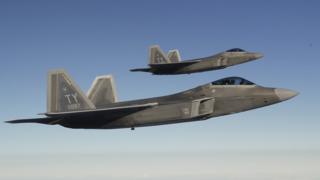 Two F-22 Raptor fighter jets approach a refuelling aircraft as they fly towards the newly established NATO airbase of Aemari, Estonia, in this file photo taken 4 September 2015