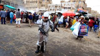 Worker disinfects pavement in the old city market in Sanaa (30/04/20)