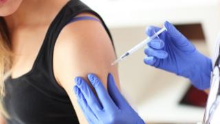 A woman being vaccinated