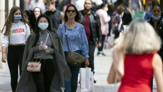 Shoppers wearing masks in Oxford Street, London