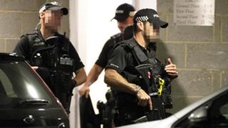 Armed officers at the scene of a stabbing