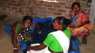 Relatives of a top Hindu priest react after he was killed in the remote northern district of Panchagarh (21 February 2016)