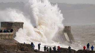 Wave crashes into harbour in Wales