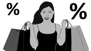 Black woman wey hold shopping bags.