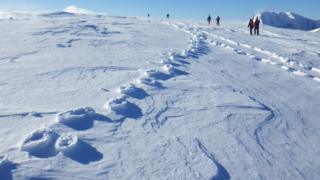 Raised footprints in snow in Lochaber