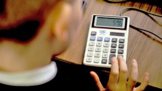 Child using calculator