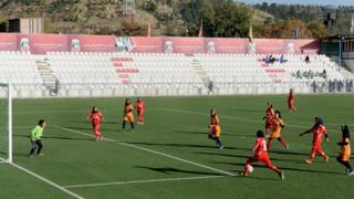 Afghan female football players vie for the ball during a football match in Kabul on November 9, 2013.