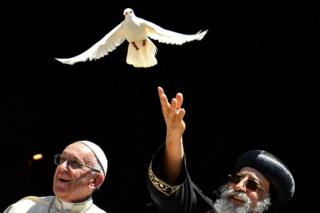 Pope Francis (l) and Coptic Pope Tawadros II, who releases a dove in Bari, Italy - Saturday 7 July 2018