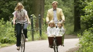 Queen Maixma and her family on bikes