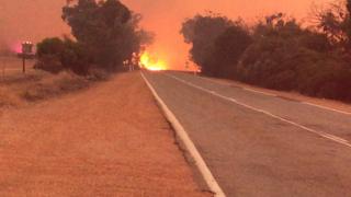 A picture of the bushfire spreading through the town of Mogumber, north of Perth