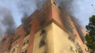 Smoke billows from a fire at a residential complex used by state oil giant Saudi Aramco in Khobar, Saudi Arabia, 30 August 2015