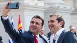 North Macedonian Prime Minister Zoran Zaev (L) makes a selfie with his Greek counterpart Alexis Tsipras prior to their meeting in Skopje on April 2, 2019.