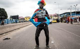 A supporter of Felix Tshisekedi holds a picture in Kinshasa, DR Congo - Thursday 10 January 2019