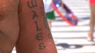 Benidorm man with Wales tattoo