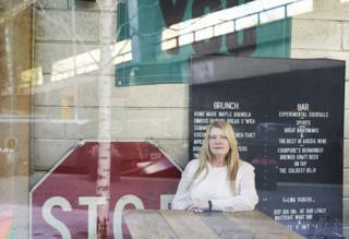 Pauline Dawes in a cafe opposite one of London's arterial roads, the Westway