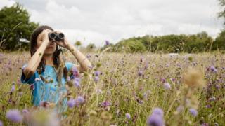 Mya-Rose Craig with binoculars