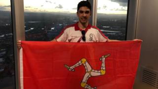 Jake Kelly holding Manx flag