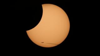 The first partial solar eclipse of 2019 dazzled skies in Eastern Asia ...