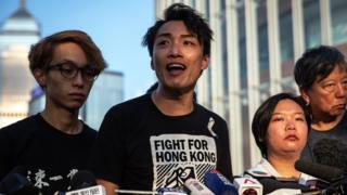 A member of Civil Human Rights Front Jimmy Sham (C) with other members speak during a news conference, next to the Legislative Council building, in Hong Kong, China, 15 June 2019