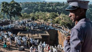 Ethiopian Orthodox pilgrims take part in the Christmas Eve celebration at Saint George Church in Lalibela, Ethiopia - Sunday 6 January 2019