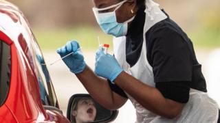 woman being tested through car window