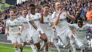 Leeds players celebrate Luke Ayling's goal against Wolves