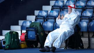 A member of the St John's Ambulance service wearing full PPE is seen prior to the Sky Bet Championship match between West Bromwich Albion and Birmingham City at The Hawthorns on June 20, 2020.