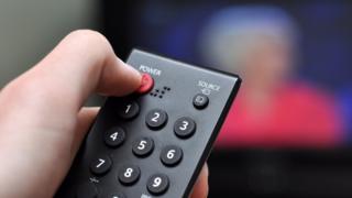 Finger pushing off on a remote
