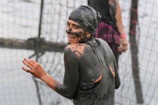 German TV host Panagiota Petridou is seen covered with mud