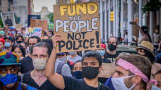 Protester holding sign