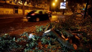 Tree branches are seen during a storm in the street, Leslie passes to Lisbon, Portugal on October 14, 2018.