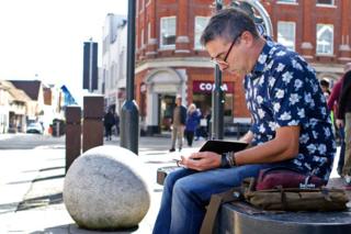 Stephen O'Grady sketching in his pad