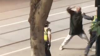 A screenshot shows an incident in which a man armed with a knife attacked several people on Bourke Street