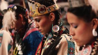 An American Indian dance group prepares to perform at a Native American gathering in Oklahoma City