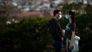 Couple in masks in Spain
