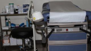Bed and pump for surgical abortions